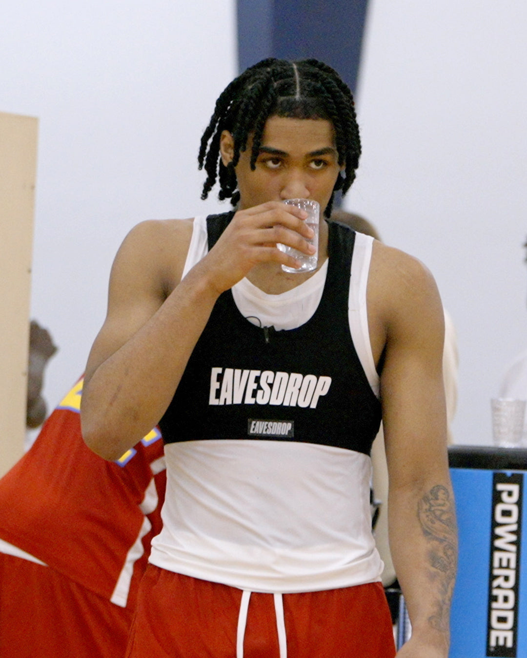 Athlete wearing an Eavesdrop mic’d-up vest