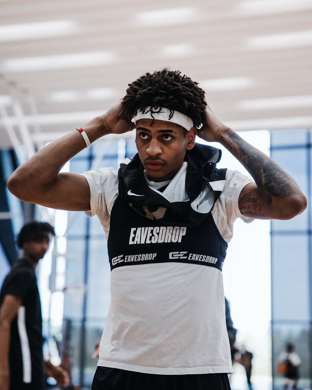 Athlete wearing an Eavesdrop vest in a basketball gym